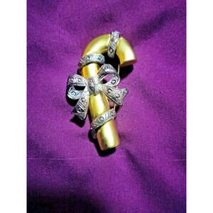 Christmas gold tone and pewter candy cane wrapped in a bow brooch/pin